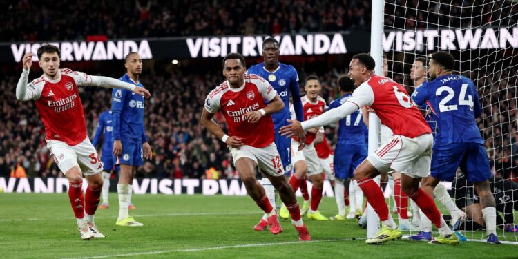 Arsenal players celebrate their second goal. | Photo: Premier League